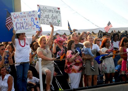 US Navy 080818-N-2838W-045 Friends and family members of Sailors assigned to the guided missile destroyer USS Gonzalez (DDG 66) welcome the ship back home photo