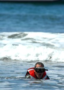 US Navy 080820-N-2959L-384 Seaman Apprentice Brian Musgrave comes up for air while swimming back to the beach during his final basic crewman training (BCT) evolution at Naval Amphibious Base Coronado photo