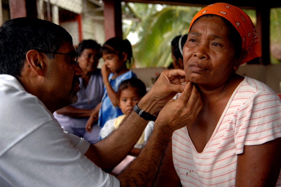 US Navy 080823-N-7544A-128 Project HOPE volunteer, Dr. Dale Rai examines a patient