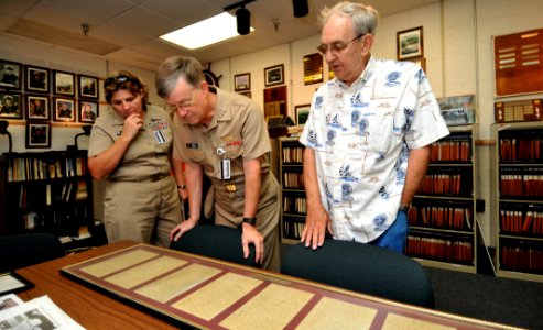 US Navy 080821-N-5328N-589 Vice Adm. H. Denby Starling II reads a hand-written letter by former Commander-in-Chief