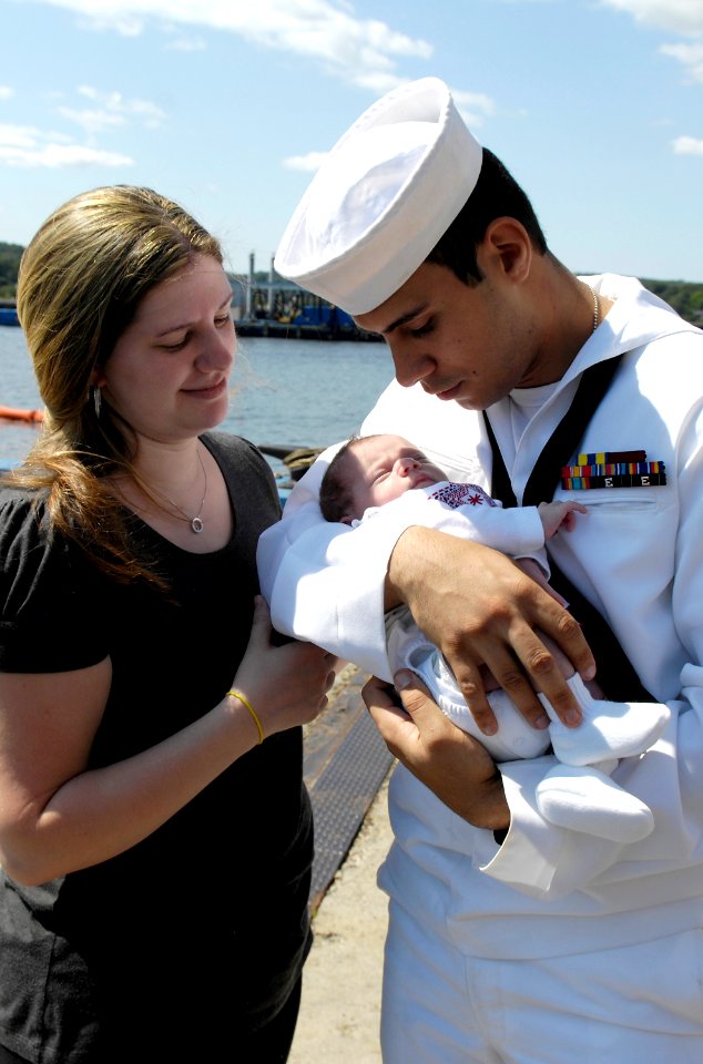 US Navy 080821-N-8467N-013 Robert Rojas holds his 2-week-old daughter for the first time