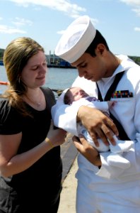 US Navy 080821-N-8467N-013 Robert Rojas holds his 2-week-old daughter for the first time