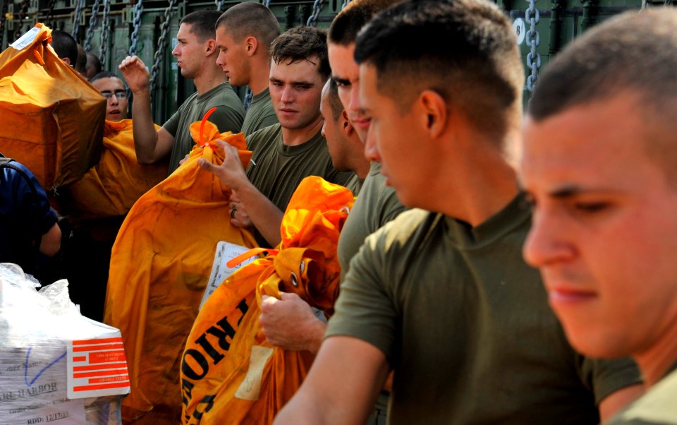 US Navy 111210-N-KS651-659 Sailors and Marines move mail during a replenishment at sea