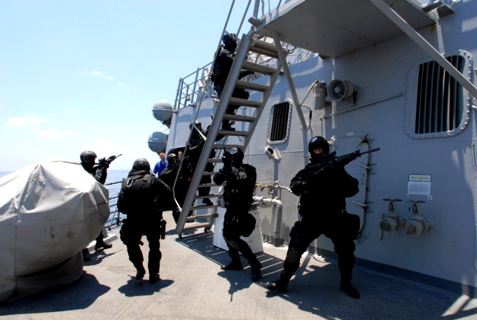 US Navy 080818-N-1635S-011 Members of the Brunei Special Forces rush towards the pilot house of the Arleigh Burke-class guided-missile destroyer USS Howard (DDG 83)