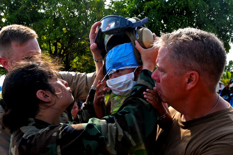 US Navy 080823-N-5642P-049 Cmdr. Freeman Dodsworth holds an Operation Smile patient