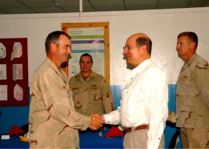 US Navy 080822-N-3560G-050 Secretary of the Navy congratulates Construction Electrician 1st Class James Harrison