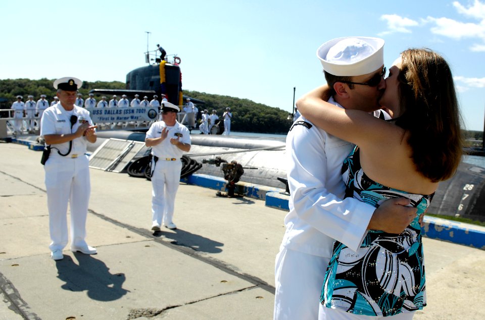 US Navy 080821-N-8467N-011 Joshua Grisham kisses his wife upon his return to Submarine New London in Groton