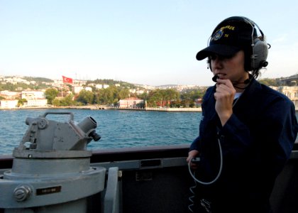 US Navy 080822-N-4044H-029 ) Quartermaster Seaman Apprentice Ashley McKee relays bearings-from-land readings taken from a telescopic alidade to the quartermasters inside the pilothouse aboard the guided-missile destroyer USS Mc