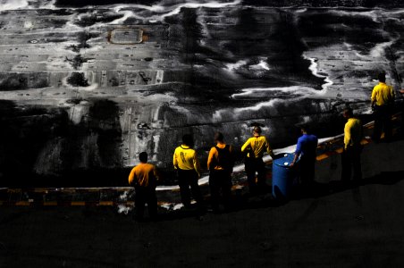 US Navy 111223-N-RG587-001 Sailors prepare to scrub the flight deck of the Nimitz-class aircraft carrier USS Carl Vinson (CVN 70)