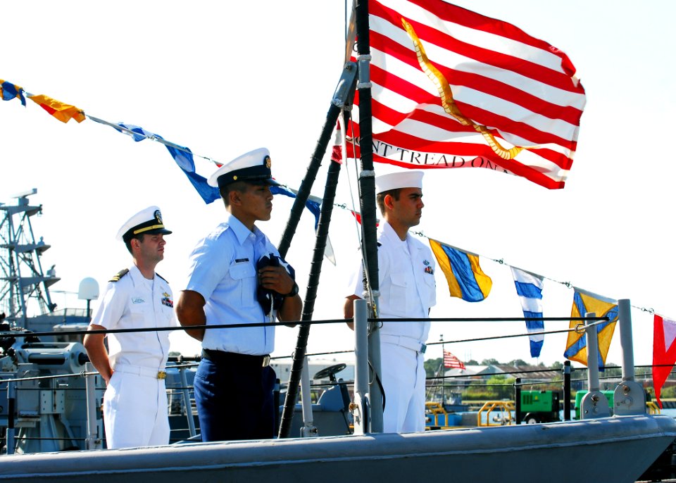 US Navy 080822-N-5033P-081 Sailors and a U.S. Coast Guardsman stand at parade rest aboard the patrol coastal ship USS Monsoon (PC 4) during the Inter-Service Transfer Ceremony