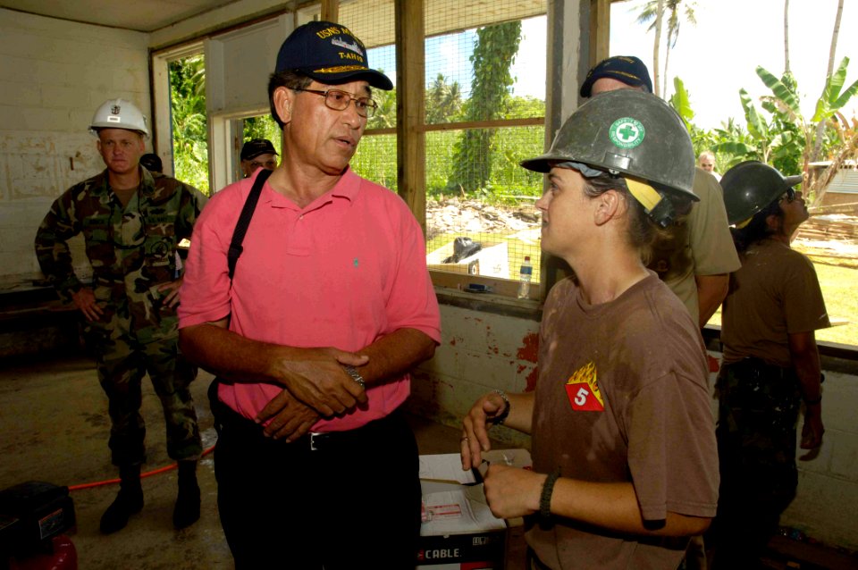 US Navy 080825-N-0209M-008 The Honorable Manny Mori, president of the Federated States of Micronesia, speaks with Builder 2nd Class Eilene Dustan at an Engineering Civic Action Program on Chuuk