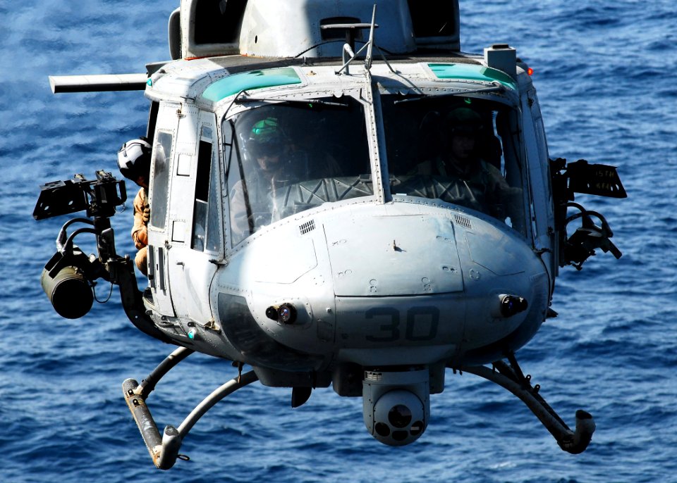 US Navy 080902-N-2183K-144 An UH-1N Twin Huey helicopter approaches the flight deck of the amphibious assault ship USS Peleliu (LHA 5)