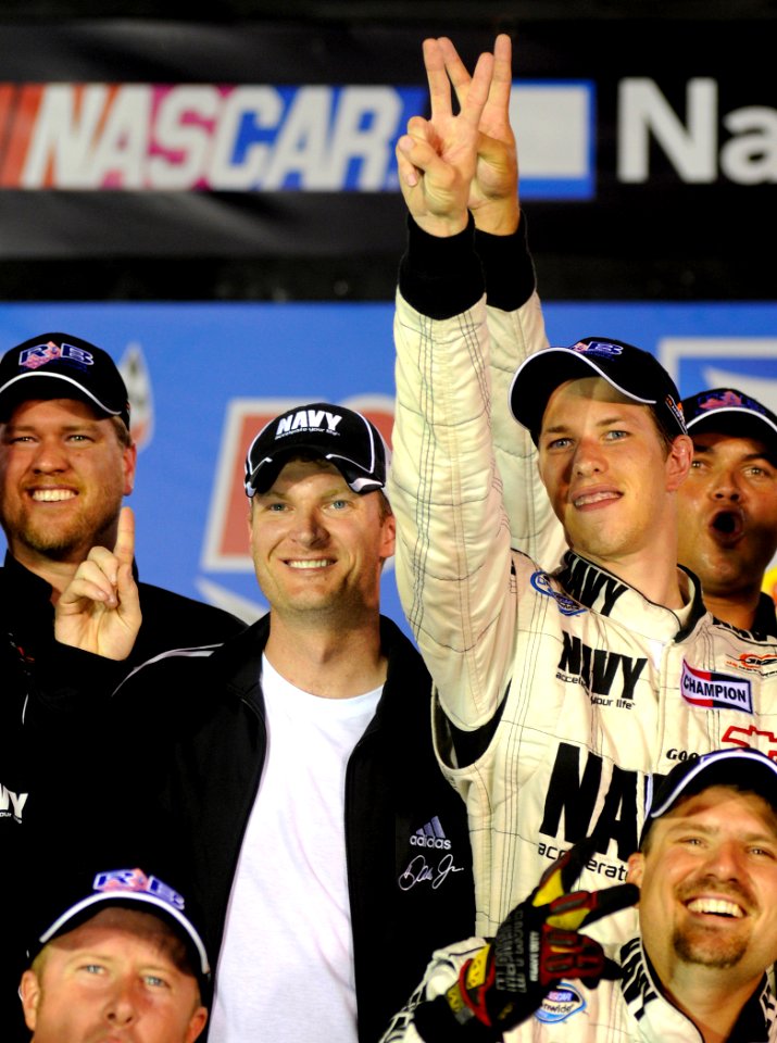 US Navy 080822-N-5345W-259 JR Motorsports co-owner Dale Earnhardt, Jr. celebrates with driver Brad Keselowski and the rest of the No. 88 U.S. Navy Chevrolet Monte Carlo team