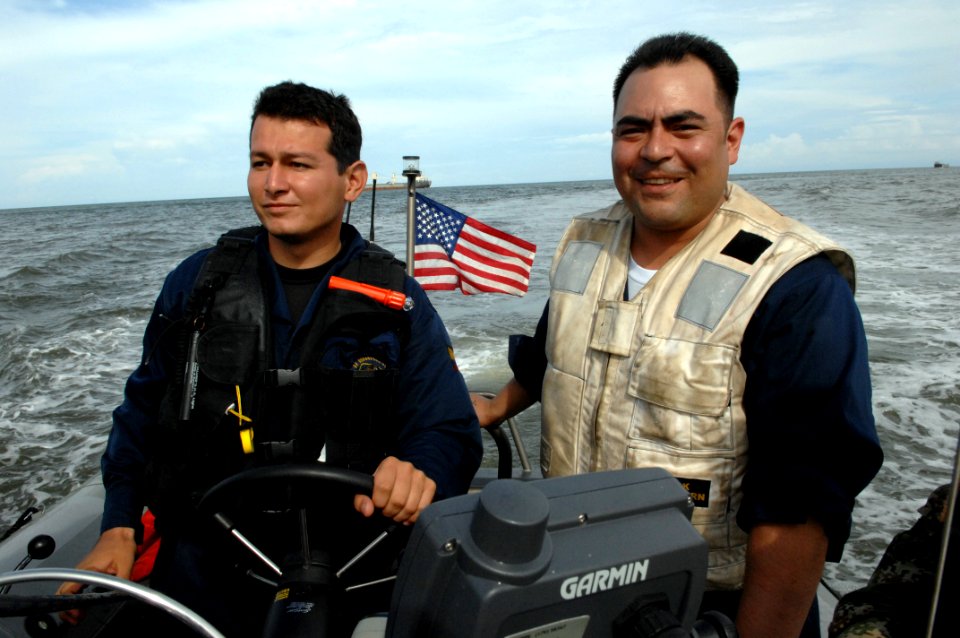 US Navy 080902-N-7544A-074 Chief Boatswain's Mate Daniel Chavez and a member of the Colombian Coast Guard drive a rigid inflatable boat