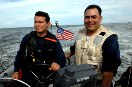 US Navy 080902-N-7544A-074 Chief Boatswain's Mate Daniel Chavez and a member of the Colombian Coast Guard drive a rigid inflatable boat