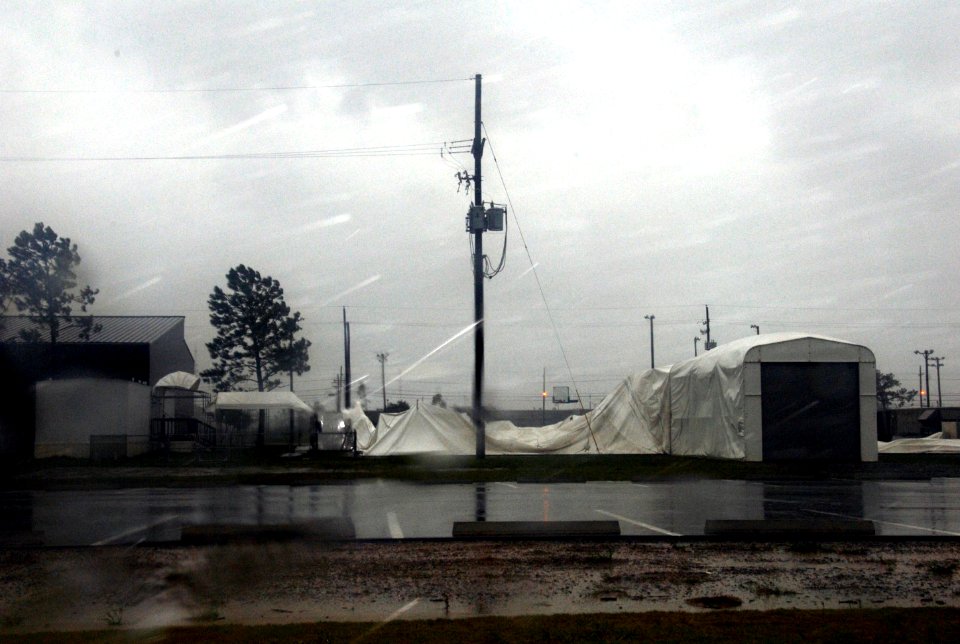 US Navy 080901-N-2468S-004 The temporary fitness facility put in place after Hurricane Katrina is ripped in half during Hurricane Gustav