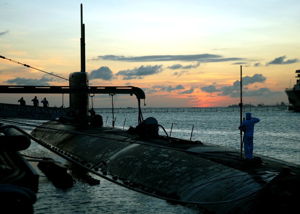 US Navy 080822-N-7668G-038 Machinist's Mate Fireman Zach Vineski, from Riverview, Mich., executes evening colors aboard the fast-attack submarine USS Scranton (SSN 756), moored at Naval Station Norfolk's Pier 3