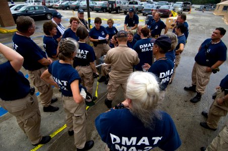 US Navy 080903-N-4154B-038 Cathy Baker briefs her teammates
