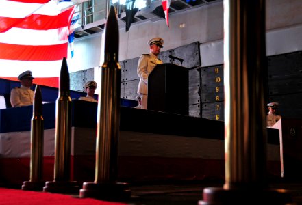US Navy 080823-N-0807W-294 Cmdr. Marvin E. Thompson reads his official orders during the amphibious dock landing ship USS Harpers Ferry (LSD 49) change of command ceremony