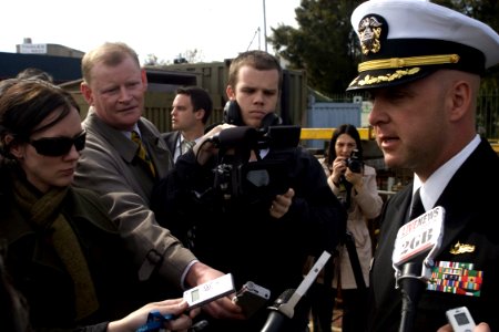 US Navy 080820-N-9123L-005 Cmdr. John S. Banigan answers questions from Australian media