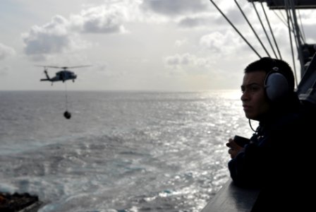 US Navy 080823-N-1635S-004 Operations Specialist 3rd Class Andrew Gomez, from Lythe, Texas, stands starboard side lookout aboard the Nimitz-class aircraft carrier USS Ronald Reagan (CVN 76)
