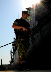 US Navy 080821-N-0780F-007 Master-at-Arms Seaman Apprentice Charles Bobola onducts a roving patrol