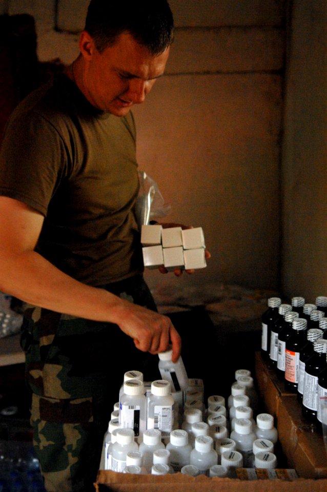 US Navy 080823-N-7544A-026 Lt. Alan Chronister organizes medications