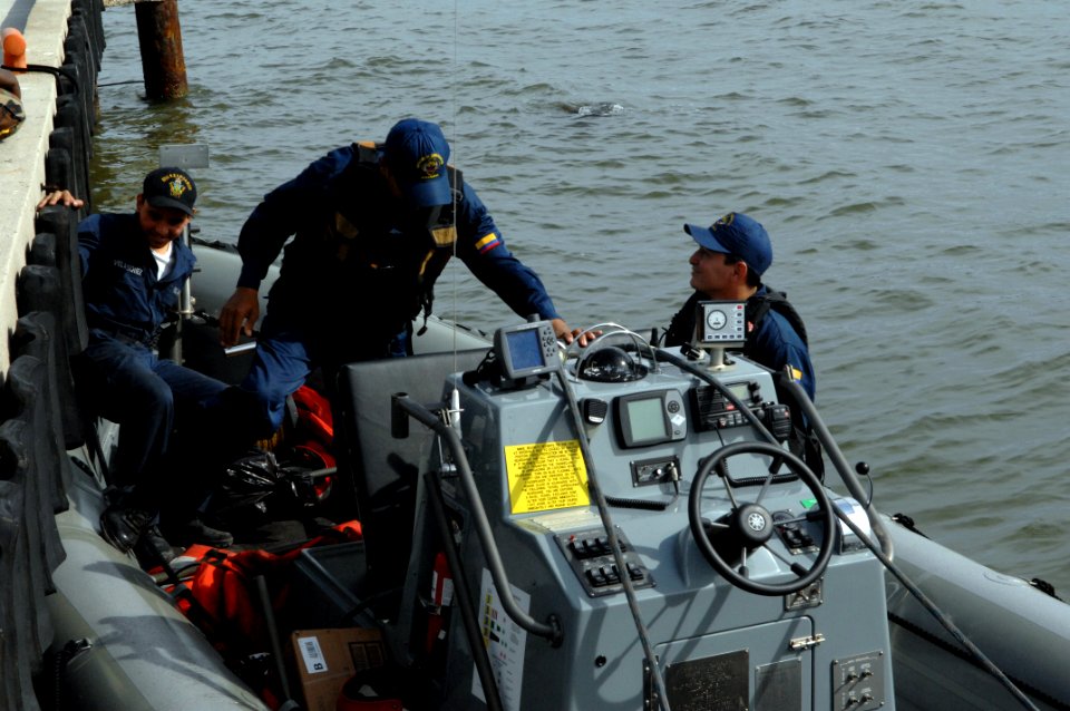 US Navy 080902-N-7544A-043 Engineman 3rd Class Aldo Velasquez and two Colombian Coast Guard members board a rigid inflatable boat