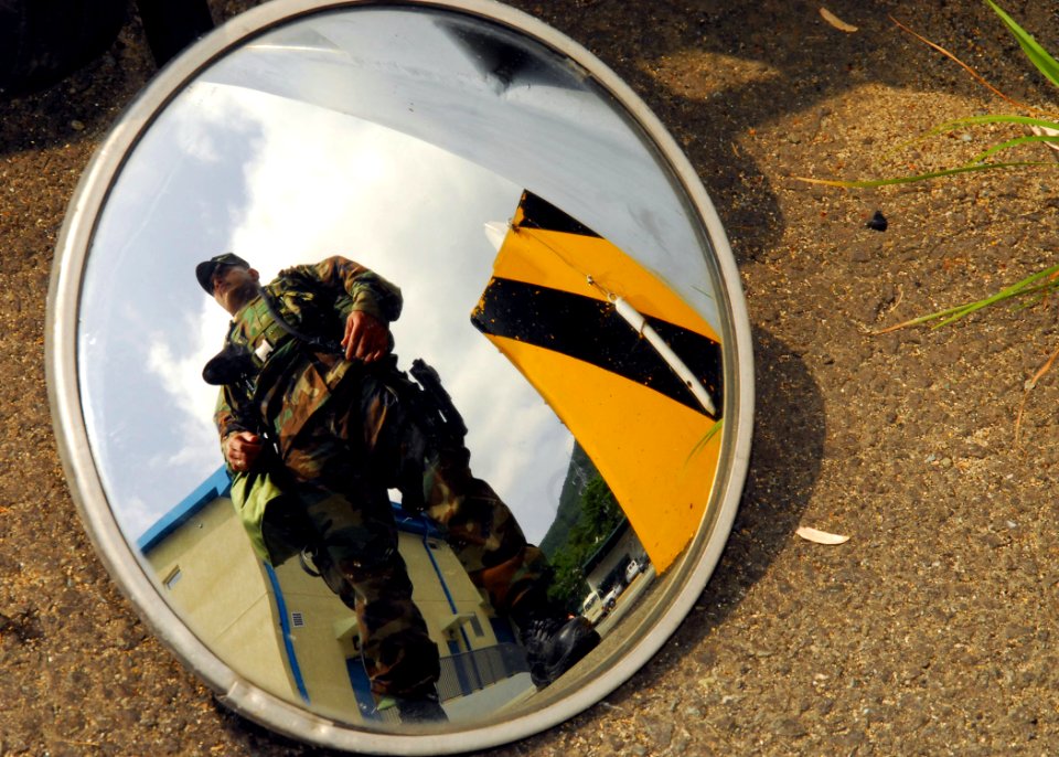 US Navy 080821-N-9573A-019 Chief Warrant Officer John Paul San Nicolas, from Guam, checks gate security during Ulchi Freedom Guardian (UFG) 2008 at Fleet Activity Command, Chinhae
