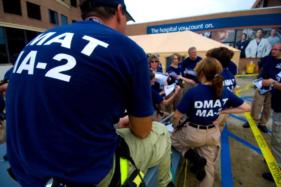 US Navy 080903-N-4154B-044 Cathy Baker briefs her teammates