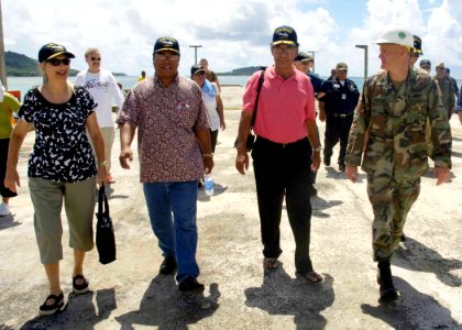 US Navy 080825-N-0209M-009 The Honorable Manny Mori, left, The Honorable Miriam K. Hughes,The Honorable Governor of the Federated States of Micronesia Wesley Simina, and EOC James Brock walk together during a tour of an Enginee