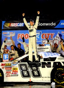 US Navy 080822-N-5345W-213 R Motorsports driver Brad Keselowski celebrates on top of the No. 88 U.S. Navy Chevrolet Monte Carlo