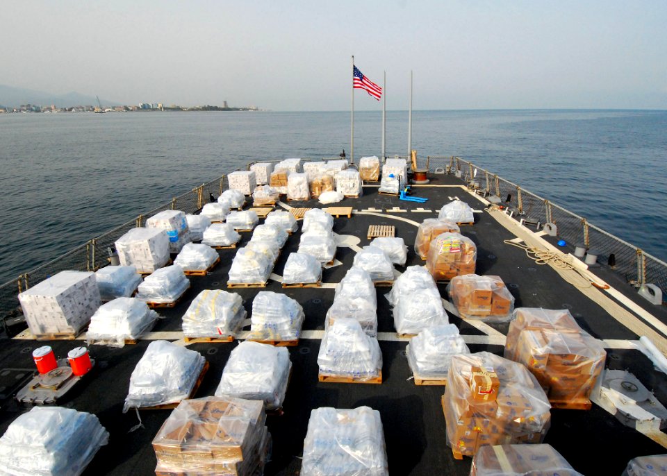 US Navy 080825-N-4044H-001 Pallets of supplies sit on the flight deck of the guided-missile destroyer USS McFaul (DDG 74)
