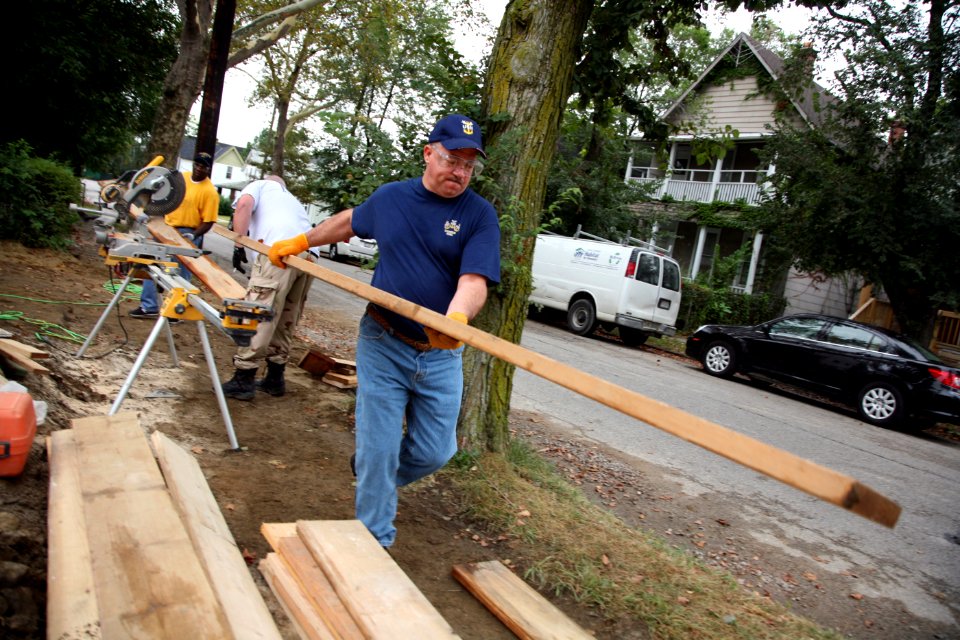 US Navy 080828-N-3271W-039 Navy Recruiting District Command Master Chief Donald Magnes cuts wood beams