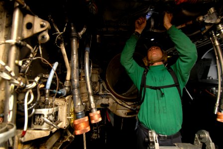 US Navy 080827-N-9079D-030 Aviation Structural Mechanic Equipment Airman Apprentice Joshua D. Holcomb changes the forward water separator on an EA-6B Prowler assigned to VAQ-131 aboard USS Abraham Lincoln (CVN 72)
