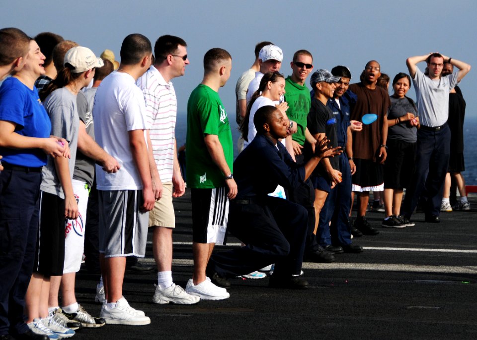 US Navy 080822-N-9898L-928 ailors aboard the aircraft carrier USS Abraham Lincoln (CVN 72) enjoy a water balloon toss game on the flight deck during a steel beach picnic