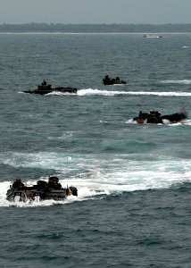 US Navy 080828-N-3392P-169 Amphibious assault vehicles prepare to embark aboard the amphibious dock landing ship USS Carter Hall (LSD 50)