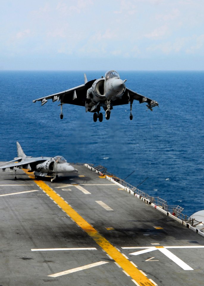 US Navy 080828-N-4236E-238 An AV-8B Harrier ands on the flight deck of the multi-purpose amphibious assault ship USS Iwo Jima (LHD 7)