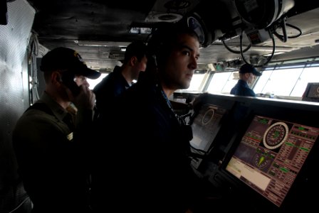 US Navy 080823-N-1635S-003 Watch standers man the helm on the bridge of the Nimitz-class aircraft carrier USS Ronald Reagan (CVN 76) during a replenishment at sea with the Military Sealift Command fast combat support ship USNS