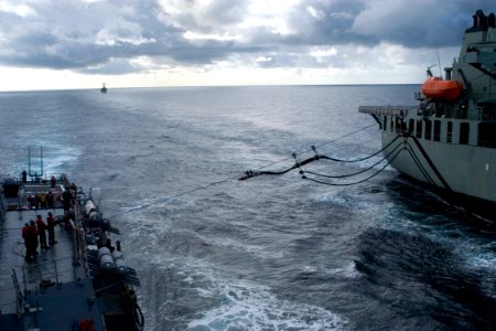 US Navy 080828-N-9123L-002 Australian Navy ship AORH Sirius (O 266) sends a fuel line to guided-missile destroyer USS John S. McCain (DDG 56)