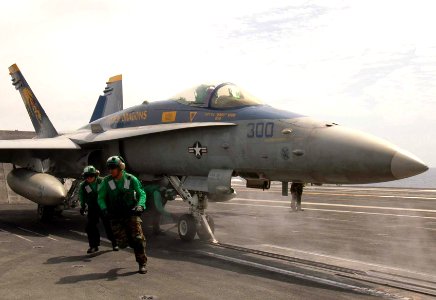 US Navy 080829-N-7282P-027 Aviation Boatswain's Mates (Equipment) run to the foul line after securing an F-A-18C Hornet