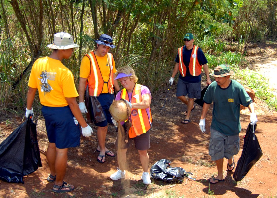 US Navy 080830-N-0641S-047 Chief petty officer selects help clean the trash out of a drainage ditch