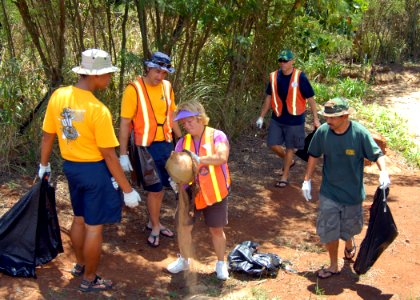 US Navy 080830-N-0641S-047 Chief petty officer selects help clean the trash out of a drainage ditch