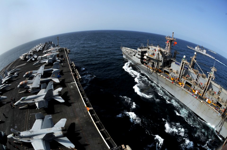 US Navy 080901-N-7981E-083 Ships steam alongside the aircraft carrier USS Abraham Lincoln (CVN 72)