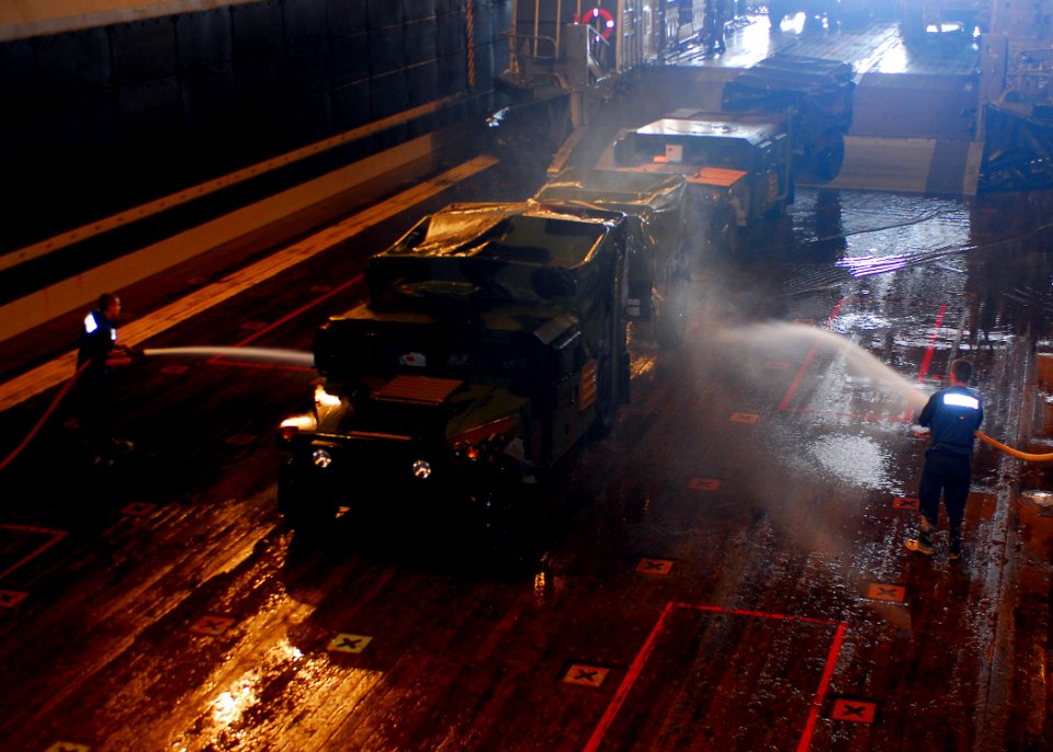 US Navy 080827-N-5681S-014 Sailors wash salt water from equipment arriving from a landing craft air cushion assigned to Assault Craft Unit (ACU) 4