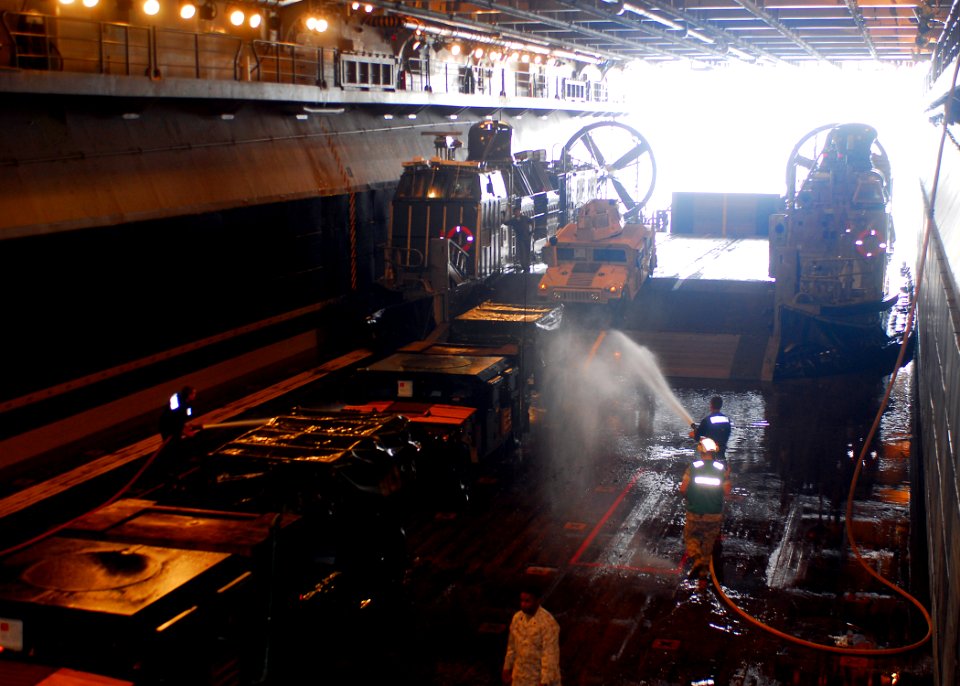 US Navy 080827-N-5681S-024 Sailors wash salt water from equipment arriving from a landing craft air cushion assigned to Assault Craft Unit (ACU) 4