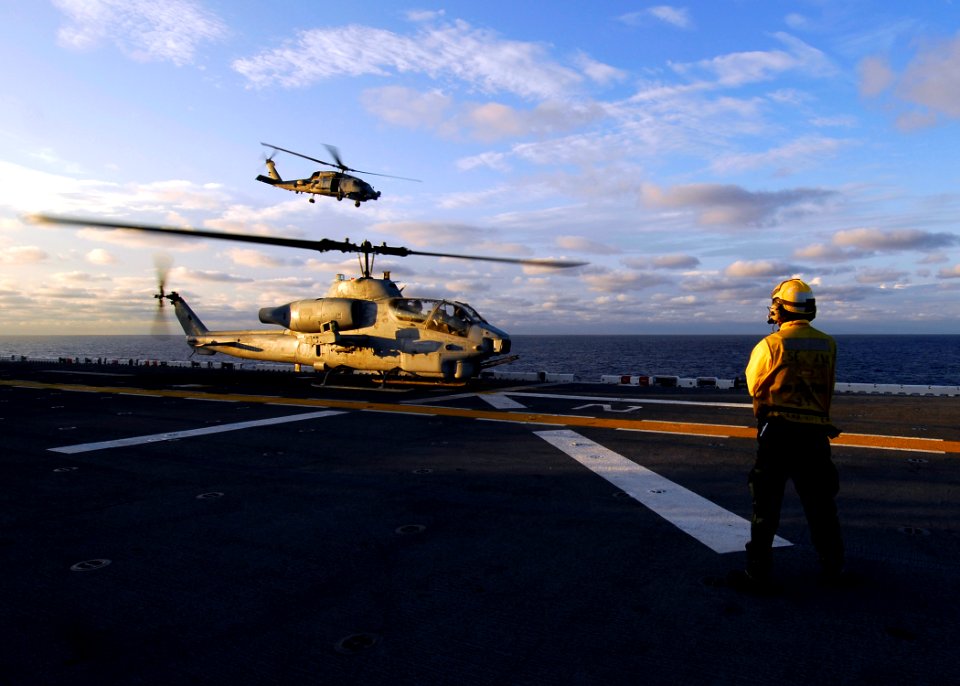 US Navy 080830-N-4236E-091 Aviation Boatswain's Mate Handling 3rd Class Lataf Bush waits to launch an AH-1W Cobra