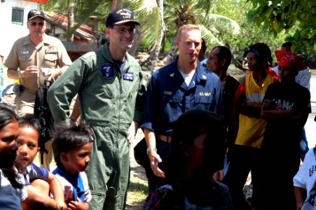 US Navy 080831-N-1328S-003 Vice Adm. John M. Bird, commander, U.S. 7th Fleet, and Chief Musician Jay Loose watch the Pacific Fleet Navy Band perform at Sappore Elementary School during a Pacific Partnership medical civic action