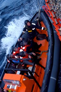 US Navy 080827-N-9123L-001 Sailors approach the ship in an Australian Navy rigid hull inflatable boat