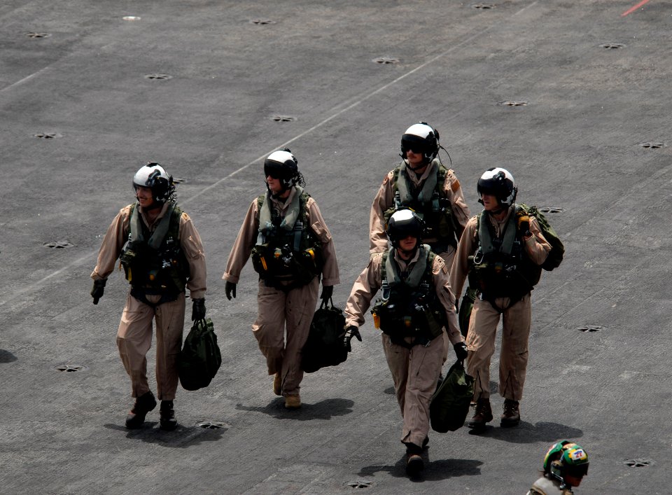 US Navy 080828-N-3610L-119 Pilots walk across the flight deck of the Nimitz-class aircraft carrier USS Ronald Reagan (CVN 76)